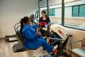 Women Exercising On A Equipment