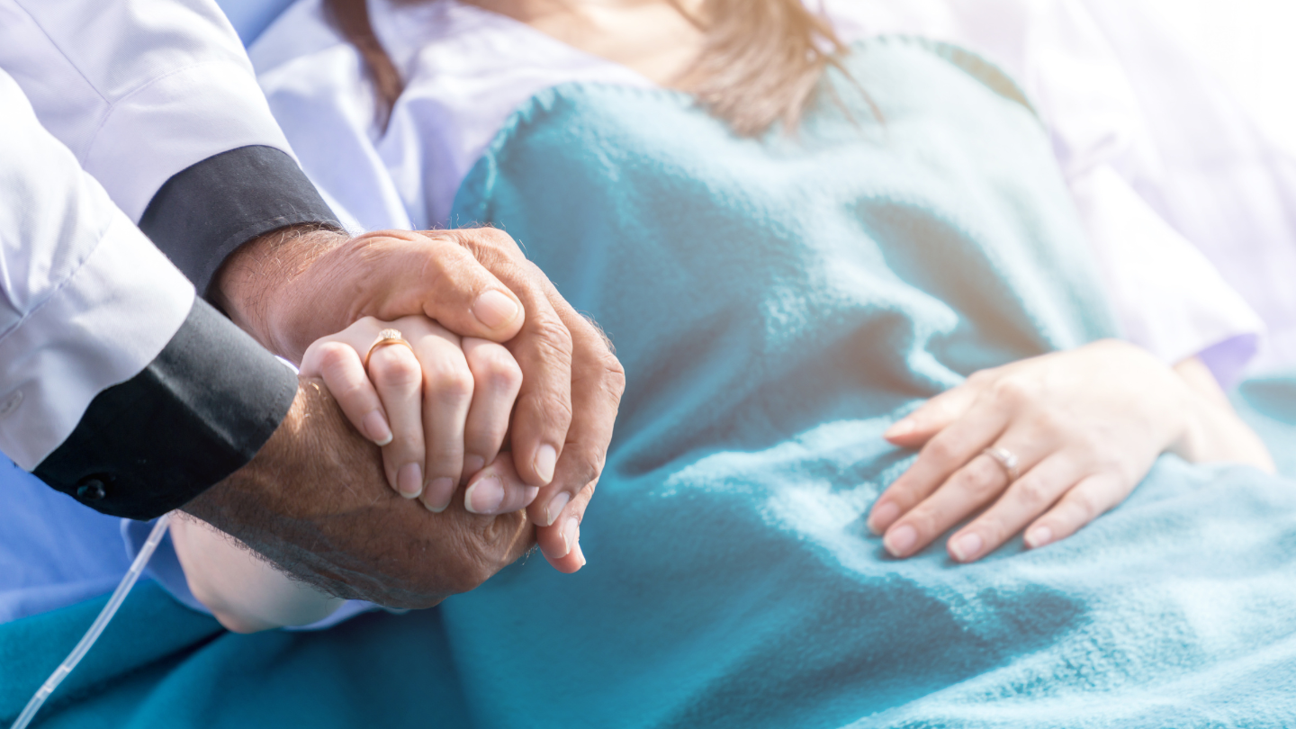 Doctor Holding Patients Hand
